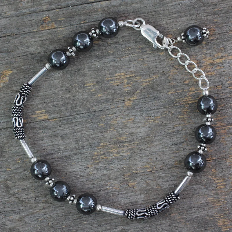 cute bracelet with floral charms -India Mystique Artisan Crafted Sterling Silver Beaded Hematite Bracelet